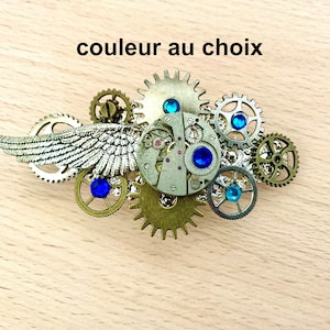 Steampunk hair clip, watch mechanism, angel wing, cogs and blue crystal