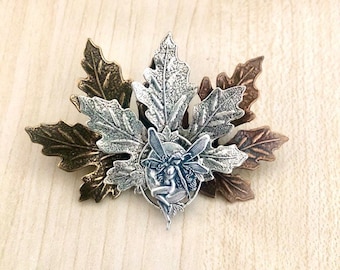 Art Nouveau brooch with elf and maple leaves