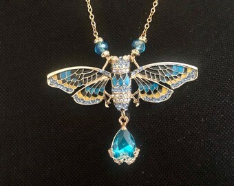 Blau-goldene Cigale-Art-Deco-Halskette mit Swarovski-Kristall und goldener Edelstahlkette