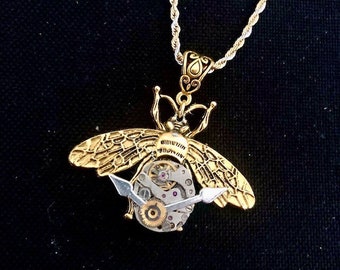 Collier steampunk insecte, avec véritable mouvement et aiguilles de montre