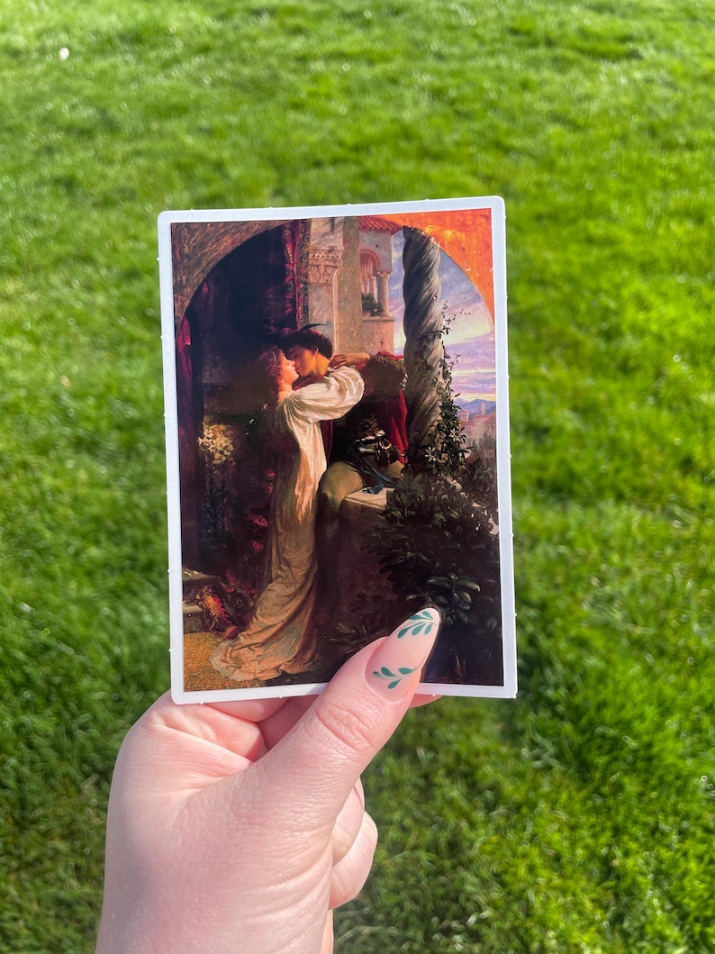 May include: A vintage-style sticker featuring a painting of a couple embracing in a romantic setting. The painting is set against a backdrop of a castle with a column and a sunset sky.