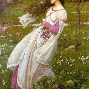 May include: A woman in a white dress with a pink sash and a bouquet of purple flowers stands in a field of green grass and pink flowers.