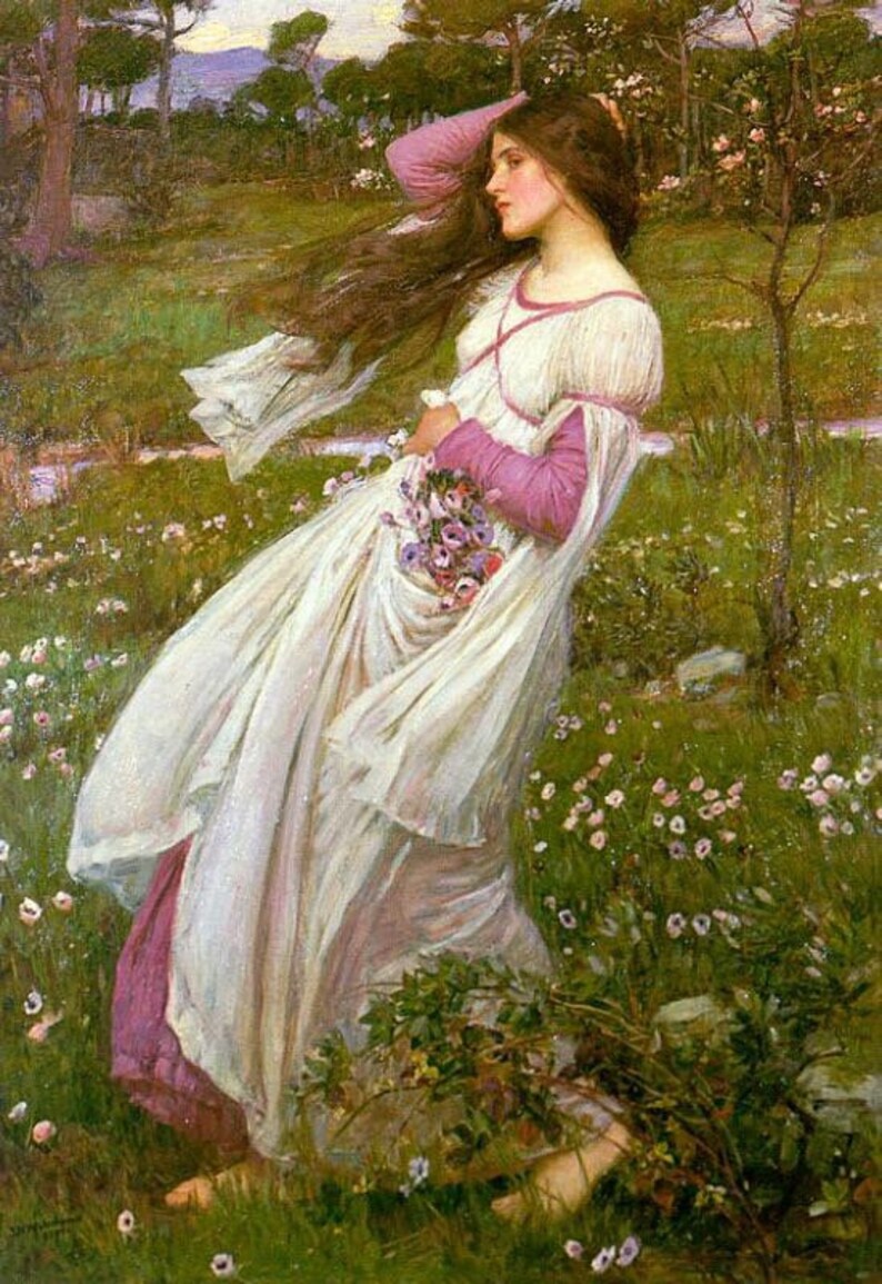 May include: A woman in a white dress with a pink sash and a bouquet of purple flowers stands in a field of green grass and pink flowers.