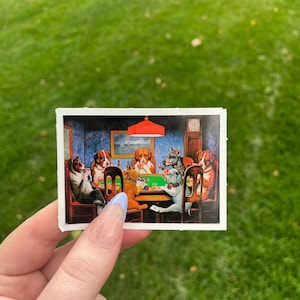 May include: A vintage-style illustration of a group of dogs playing cards around a green felt table. The dogs are wearing collars and are sitting in chairs. There is a red lampshade hanging above the table.