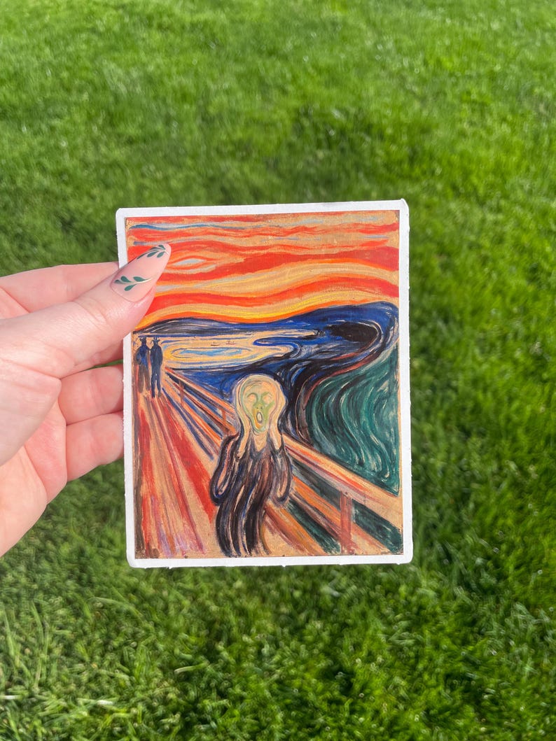 May include: A sticker featuring a painting of a person screaming with a bright red, orange, and yellow sky in the background. The painting is known as "The Scream" by Edvard Munch.