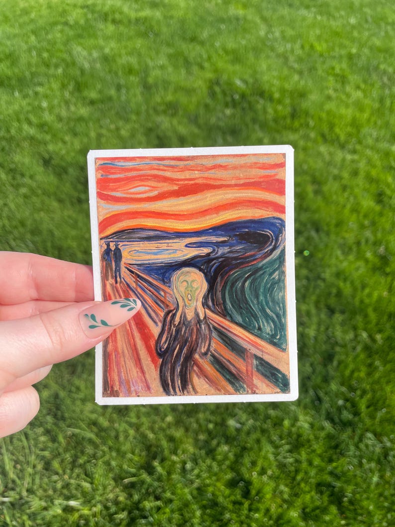 May include: A sticker featuring a reproduction of Edvard Munch's famous painting "The Scream". The painting depicts a figure with a distorted face screaming against a swirling, red and orange sky.
