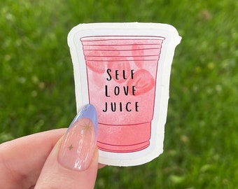 May include: Pink sticker with a white outline of a red plastic cup filled with a pink liquid and the text "SELF LOVE JUICE".
