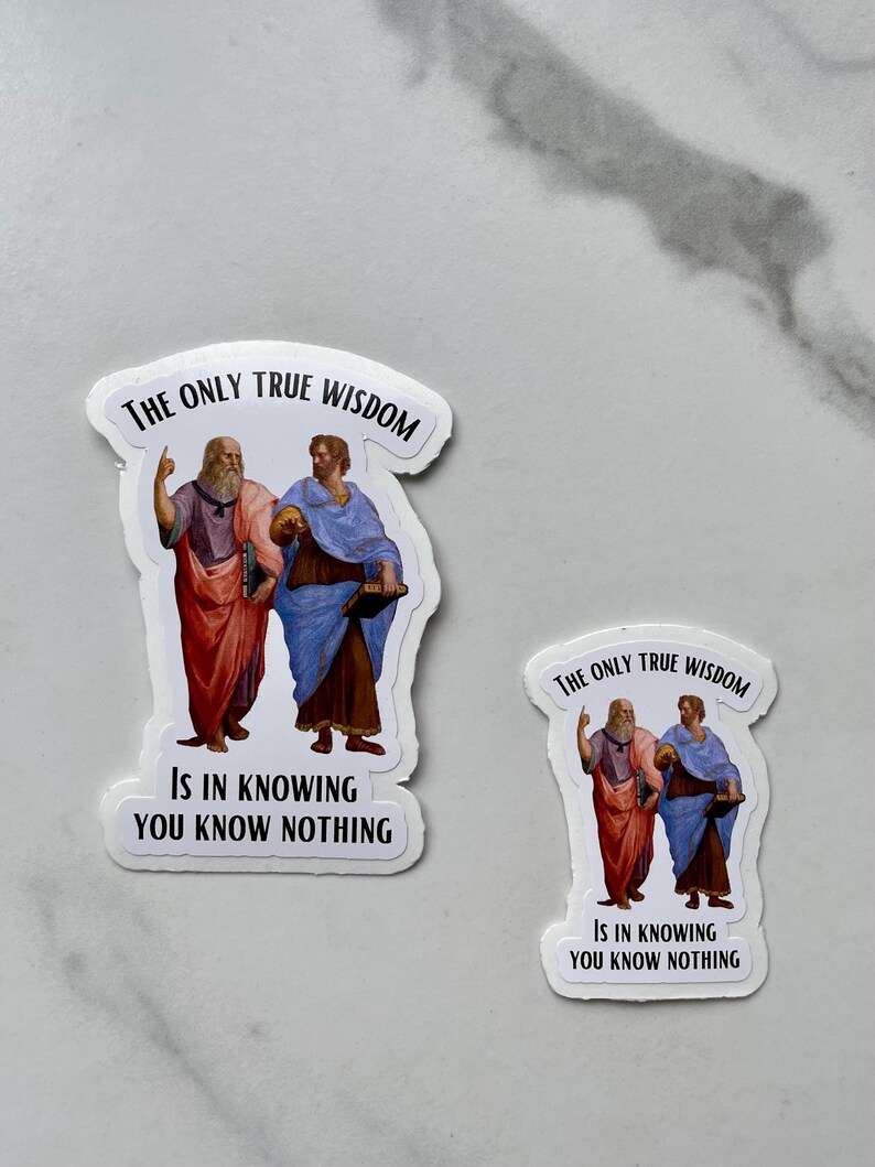 May include: Two white stickers with a black border. Each sticker features a painting of two men in robes. The text on the stickers reads "The only true wisdom is in knowing you know nothing."
