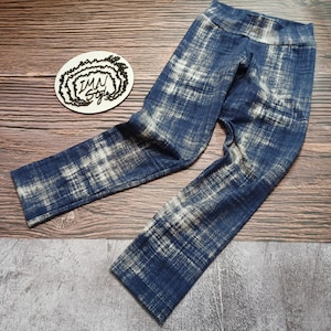 May include: Blue and white patterned leggings with a high waist.