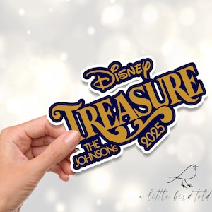 May include: A gold and blue Disney Treasure sticker with the text "Disney Treasure 2025" and "The Johnsons" in a decorative font.