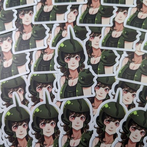 May include: A collection of stickers featuring a cartoon character wearing a green helmet and armor. The character has brown hair and is smiling. The stickers are printed on white paper.