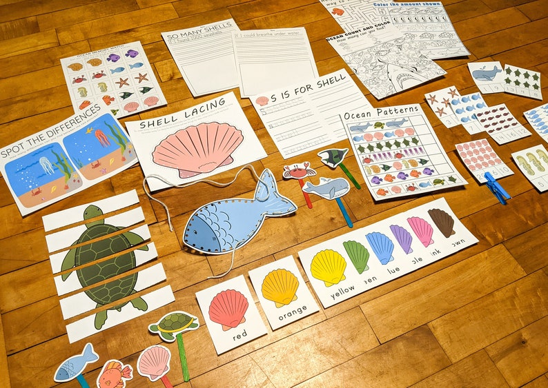 May include: A set of printable ocean-themed educational activities for children. The set includes a variety of activities such as counting, matching, and sorting. The activities are designed to help children learn about the ocean and its creatures.