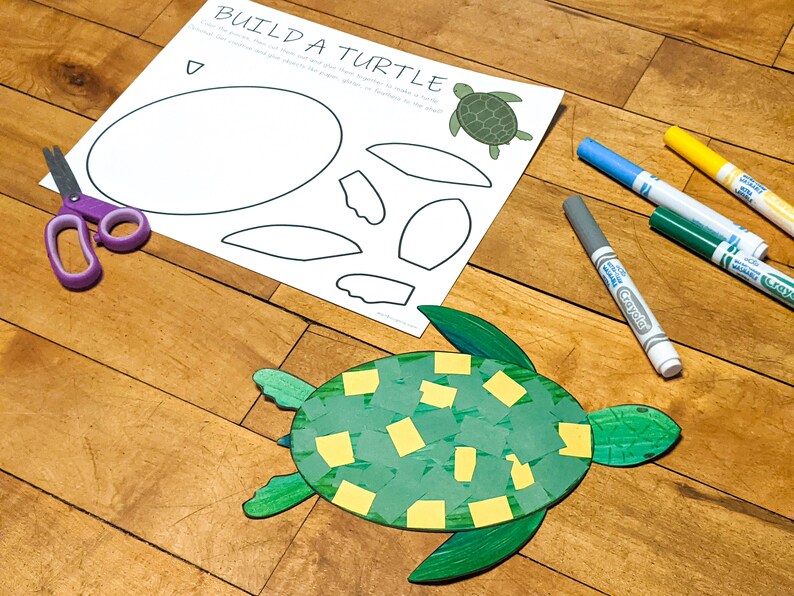 May include: A craft project for making a turtle. The image shows a printed template with a turtle outline, a completed turtle made of green paper and yellow squares, and markers.