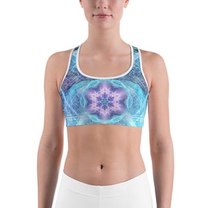 May include: A blue and purple sports bra with a geometric pattern and a mandala design in the centre.