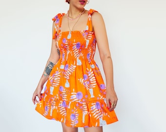 Orange WildFlower" print shirred mini dress in organic cotton | Mini frilled floral Sundress