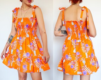 Orange WildFlower" print shirred mini dress in organic cotton | Mini frilled floral Sundress