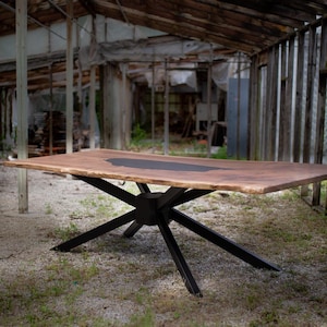Walnut and black epoxy single slab dining / conference table