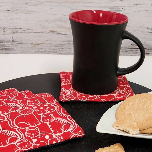 Fabric red coaster with white cat.
