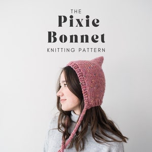 May include: A pink knitted pixie bonnet with long ties. The bonnet has a pointed top and a speckled pattern. The text "THE Pixie Bonnet KNITTING PATTERN" is above the image.