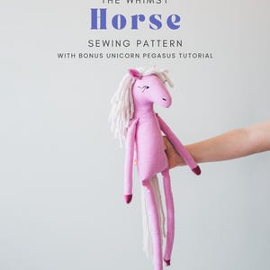 May include: A pink fabric horse doll with a white yarn mane and tail, featuring dark pink hooves and embroidered facial details. The text above reads: THE WHIMSY Horse SEWING PATTERN WITH BONUS UNICORN PEGASUS TUTORIAL.