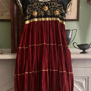 Vintage festival dress India, gold embroidery on black, empire waist, red full skirt, pleats
