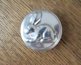 vintage round metal rabbit mold