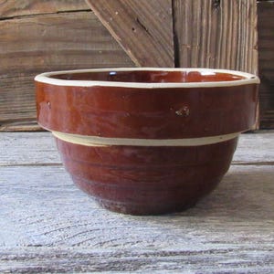 May include: A set of three ceramic mugs with a speckled, matte finish. The mugs are in shades of cream, light gray, and dark gray. Each mug has a simple, minimalist design, perfect for coffee or tea.