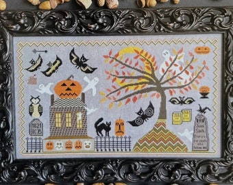 May include: A cross-stitch pattern for a haunted house with a jack-o-lantern, bats, owls, and a spooky tree. The pattern is titled "Haunted" by Kathy Barrick.
