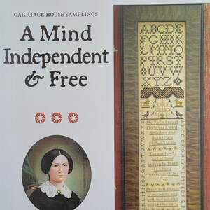 May include: A framed sampler with the text "A Mind Independent & Free" and a portrait of a woman. The sampler features cross-stitch alphabet, decorative motifs, and a poem. The text "This work complete January 26 1824" is also visible.