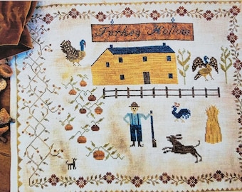May include: Cross-stitch pattern for a farmhouse scene titled "Turkey Hollow Farm". The pattern features a yellow house with a blue roof, a fence, a farmer with a gun, a dog, and a turkey.