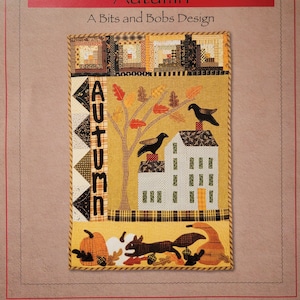 May include: A quilting pattern titled "Autumn" by Norma Whaley. The pattern features a house, a tree with leaves, birds, pumpkins, and a squirrel. The finished size is 18 inches by 23 inches.