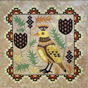 May include: A cross-stitch design featuring a yellow bird with intricate patterns, surrounded by stylized flowers and foliage in shades of brown, green, and black. The design is framed by a decorative border with floral motifs. The overall aesthetic is reminiscent of folk art.