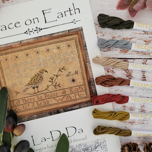 Paquet de soie dentaire NPI pour la paix sur Terre par La-D-Da