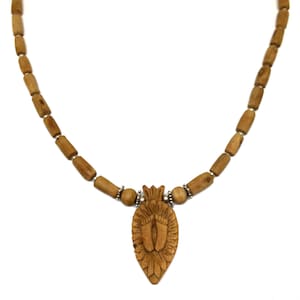 May include: A wooden necklace with a pendant featuring a carved design of two footprints. The necklace is made of brown wooden beads and has silver accents.