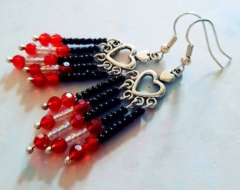 Silver earrings with heart ornaments and crystal