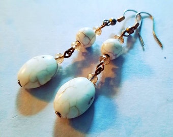 Long silver earrings with white ceramic