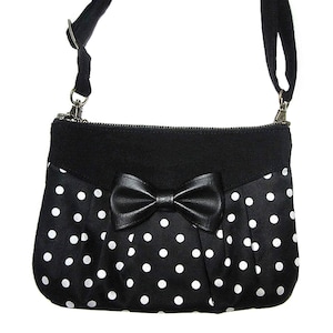 Black and white polka dots small bag with or without bow. Pouch 3 in 1. Can be worn on your shoulder, waist, hand or accross your body.