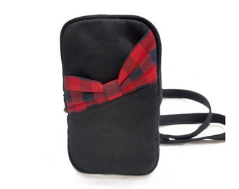 Black multifunctional bag with front red plaid bow pocket. Travel bag can be worn on your shoulder, waist or accross your body. Rockabilly.