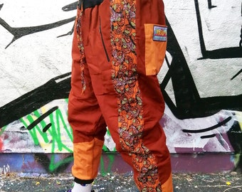 JACKFRUIT I DEAL Festival Pants Afro Disco Orange Unisex Fleece