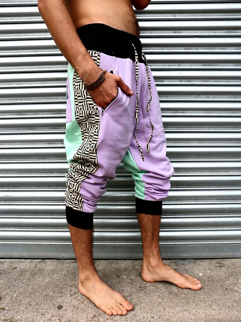 May include: Purple, green, and black patterned pants with a drawstring waist.