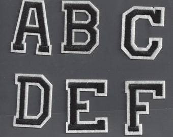 Iron on letters embroidered black on white border top quality.  2  inch tall