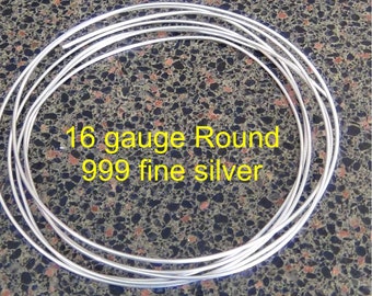 May include: A coil of 16 gauge round 999 fine silver wire. The wire is silver in color and is coiled in a circle.