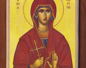 May include: A religious icon depicting a woman in a red robe holding a cross. The icon has a yellow background with a halo around the woman's head. The text "Ma Pi Na" is written in the top right corner of the icon.