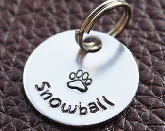 Personalised Pet Tag. Put your pet's name on an aluminium round disc featuring a hand-stamped paw print. Pet Id Tag. Name Tag.