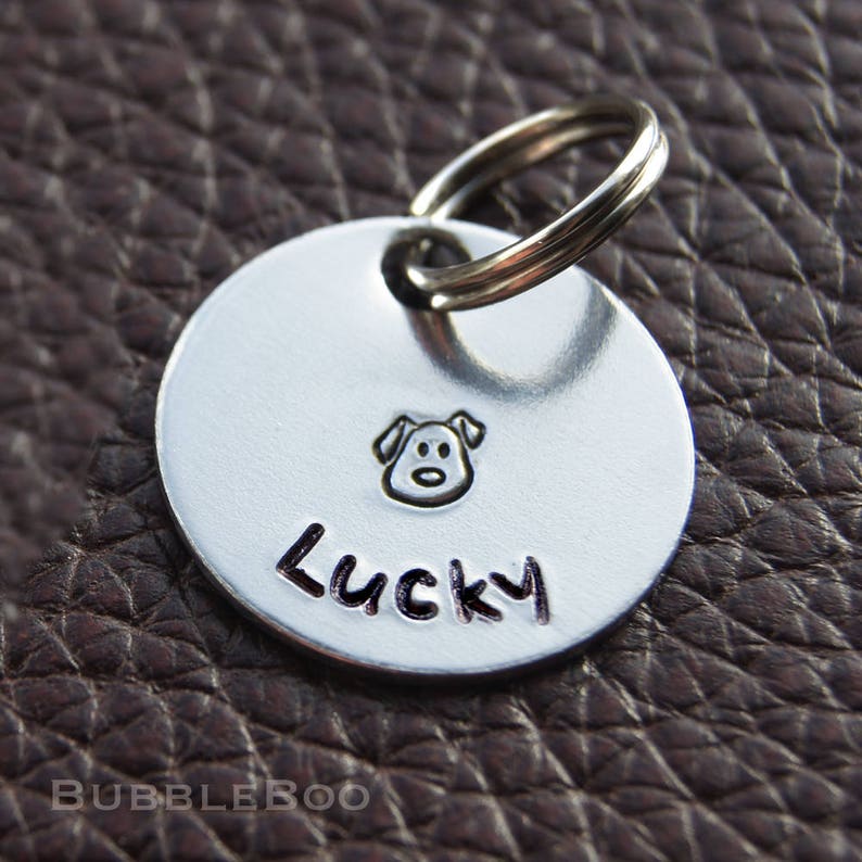 Personalised Dog Tag. Put your dog's name on an aluminium round disc featuring a hand-stamped puppy. Pet Id Tag. Pet Name Tag. Gift Boxed. image 1