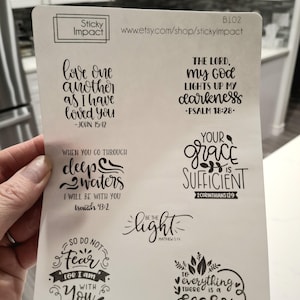 May include: A white sheet with black text and images. The text includes Bible verses and inspirational quotes. The images include a wave, a light bulb, a heart with leaves, and a heart with a flower.