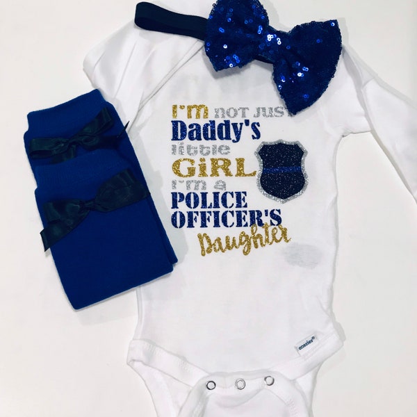 I'm not just daddy's (mommy's) little girl I'm a police officers daughter onesie set available with matching leg warmers and bow option