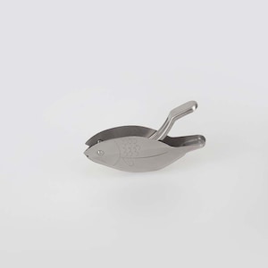 May include: A silver fish-shaped citrus juicer with a lever to squeeze the fruit.