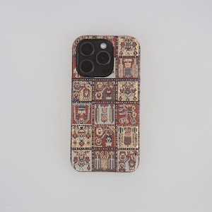 May include: A phone case featuring a colourful geometric pattern in shades of red, gold, and white. The case has a cut-out for the camera lens.