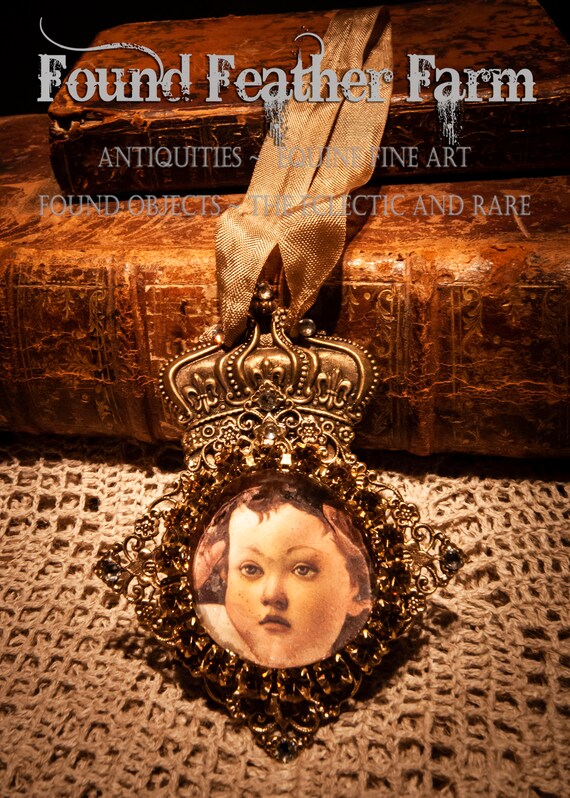 Handmade Magnet with a Jeweled Embellished Glass Cabochon on Brass and Featuring An Image of the Christ Child with a Bronze Crown